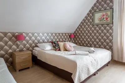 Łóżko lub łóżka w pokoju w obiekcie APARTAMENTY VILLA PIGMALION - sauna, jacuzzi, parking, ogród