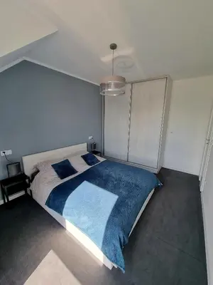 Łóżko lub łóżka w pokoju w obiekcie Domek pod świerkami - 