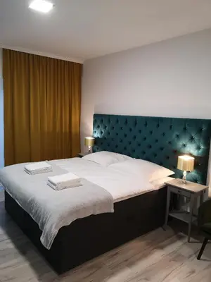 Łóżko lub łóżka w pokoju w obiekcie Apartamenty Lawendowy Zakątek 2