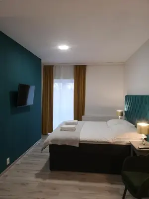 Łóżko lub łóżka w pokoju w obiekcie Apartamenty Lawendowy Zakątek 2