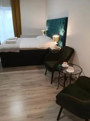 Łóżko lub łóżka w pokoju w obiekcie Apartamenty Lawendowy Zakątek 2