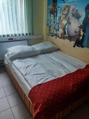 Łóżko lub łóżka w pokoju w obiekcie Noclegi Tyniec