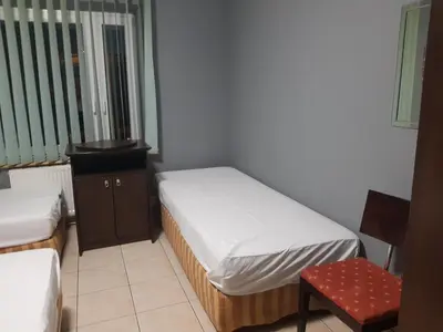 Łóżko lub łóżka w pokoju w obiekcie Noclegi Tyniec