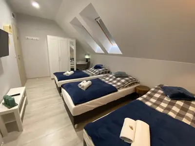 Łóżko lub łóżka w pokoju w obiekcie Gościniec przy Spacerowej