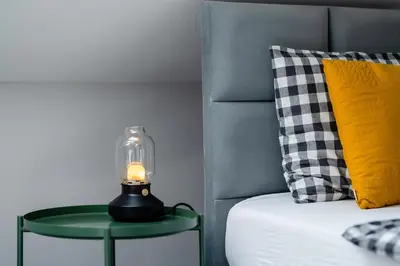 Łóżko lub łóżka w pokoju w obiekcie APARTAMENTY ISKRA