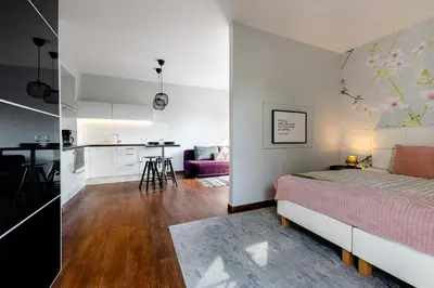 Łóżko lub łóżka w pokoju w obiekcie APARTAMENTY ISKRA