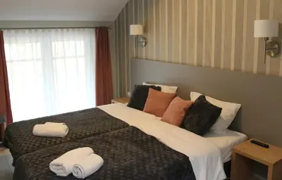 Łóżko lub łóżka w pokoju w obiekcie Apartament Czarna Góra S26