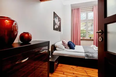 Łóżko lub łóżka w pokoju w obiekcie Apartament Nowa 12