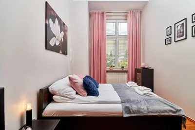 Łóżko lub łóżka w pokoju w obiekcie Apartament Nowa 12