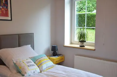 Łóżko lub łóżka w pokoju w obiekcie Apartament Fabryka Endorfin Kłodzko