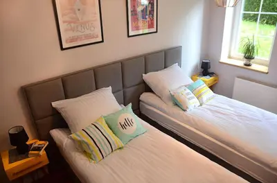 Łóżko lub łóżka w pokoju w obiekcie Apartament Fabryka Endorfin Kłodzko