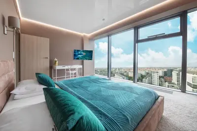 Łóżko lub łóżka w pokoju w obiekcie Apartamenty Sky Tower by BQQK