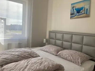 Łóżko lub łóżka w pokoju w obiekcie Przestronny Apartament