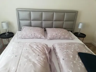 Łóżko lub łóżka w pokoju w obiekcie Przestronny Apartament