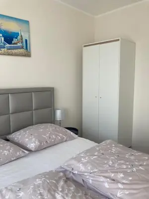 Łóżko lub łóżka w pokoju w obiekcie Przestronny Apartament
