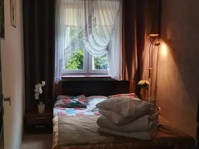 Łóżko lub łóżka w pokoju w obiekcie Apartamenty Rodzinne