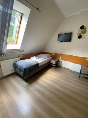 Łóżko lub łóżka w pokoju w obiekcie Willa Jarzębina