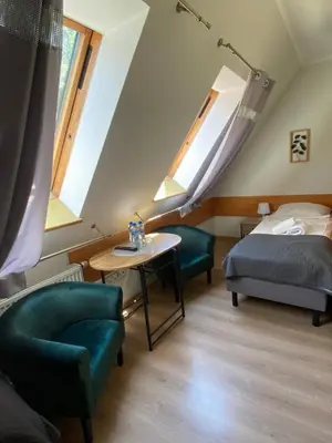 Łóżko lub łóżka w pokoju w obiekcie Willa Jarzębina
