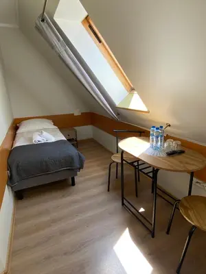 Łóżko lub łóżka w pokoju w obiekcie Willa Jarzębina