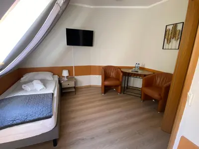 Łóżko lub łóżka w pokoju w obiekcie Willa Jarzębina