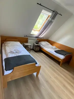 Łóżko lub łóżka w pokoju w obiekcie Willa Jarzębina