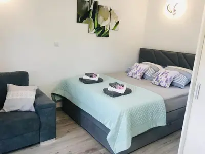 Łóżko lub łóżka w pokoju w obiekcie Apartamenty Pod Cisem