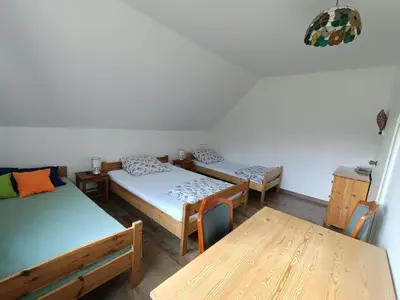 Łóżko lub łóżka w pokoju w obiekcie Maślana Chata