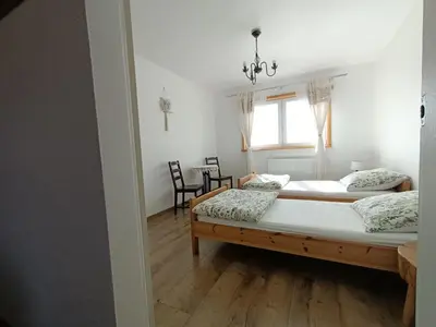 Łóżko lub łóżka w pokoju w obiekcie Maślana Chata