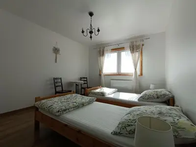 Łóżko lub łóżka w pokoju w obiekcie Maślana Chata