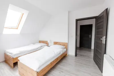 Łóżko lub łóżka w pokoju w obiekcie Pokoje Gościnne TOPOLA