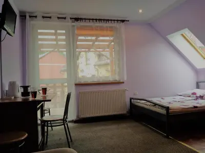 Łóżko lub łóżka w pokoju w obiekcie Na Skwerku