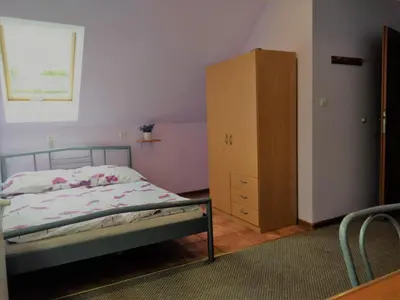 Łóżko lub łóżka w pokoju w obiekcie Na Skwerku