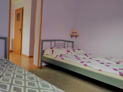 Łóżko lub łóżka w pokoju w obiekcie Na Skwerku
