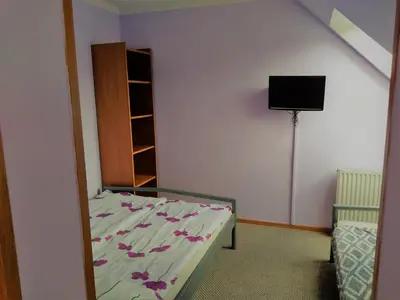 Łóżko lub łóżka w pokoju w obiekcie Na Skwerku