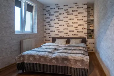 Łóżko lub łóżka w pokoju w obiekcie JDK Apartamenty Legionów 50m2 5-osobowy