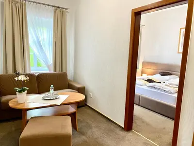 Łóżko lub łóżka w pokoju w obiekcie Park Hotel Dobrodzień