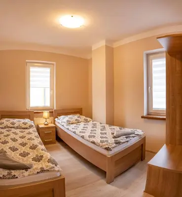 Łóżko lub łóżka w pokoju w obiekcie Willa Nad Potokiem