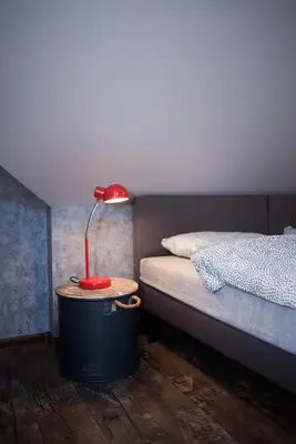 Łóżko lub łóżka w pokoju w obiekcie JDK Apartamenty Legionów 40m2 5-osobowy