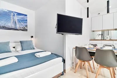 Łóżko lub łóżka w pokoju w obiekcie Apartments Wroclaw Pulaskiego by Noclegi Renters