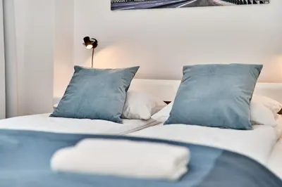 Łóżko lub łóżka w pokoju w obiekcie Apartments Wroclaw Pulaskiego by Noclegi Renters