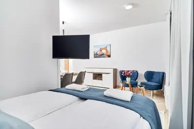 Łóżko lub łóżka w pokoju w obiekcie Apartments Wroclaw Pulaskiego by Noclegi Renters