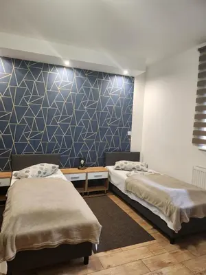 Łóżko lub łóżka w pokoju w obiekcie HOTELIK Hacjenda