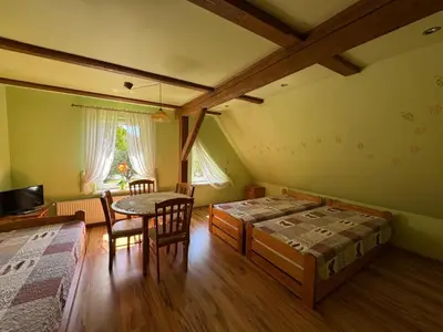 Łóżko lub łóżka w pokoju w obiekcie Pokoje gościnne Helena
