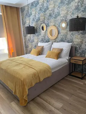 Łóżko lub łóżka w pokoju w obiekcie Apartament BellaPola Loft