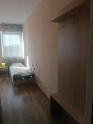 Łóżko lub łóżka w pokoju w obiekcie NOCLEGI Niemodlin