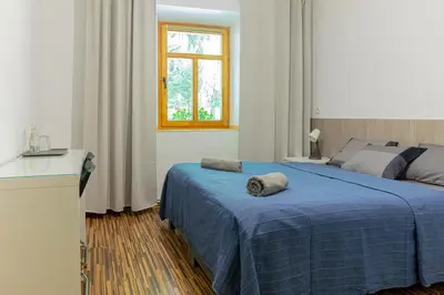 Łóżko lub łóżka w pokoju w obiekcie Schronisko PTTK Pasterka