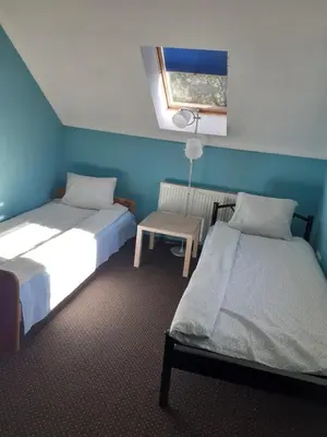 Łóżko lub łóżka w pokoju w obiekcie Noclegi w Kudowie