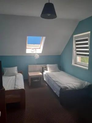 Łóżko lub łóżka w pokoju w obiekcie Noclegi w Kudowie