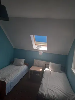 Łóżko lub łóżka w pokoju w obiekcie Noclegi w Kudowie