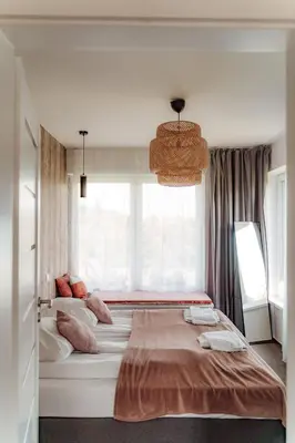 Łóżko lub łóżka w pokoju w obiekcie Jeleni Jar Apartamenty